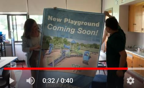 Winchester student with playground sign