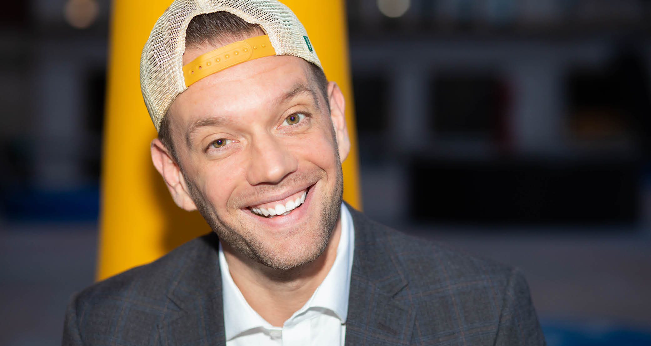 photo of Joshua Rivedel wearing a backwards baseball hat