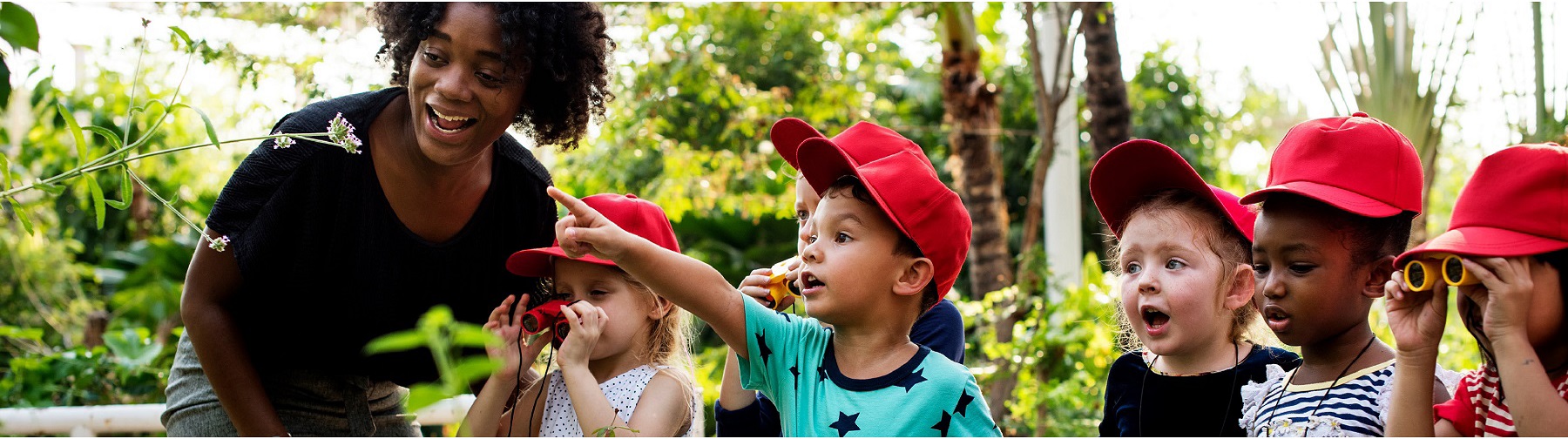 students and teacher exploring on a field trip to a zoo