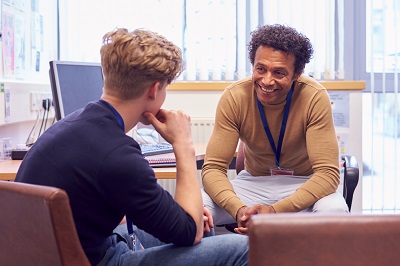 school counselor speaking to a student