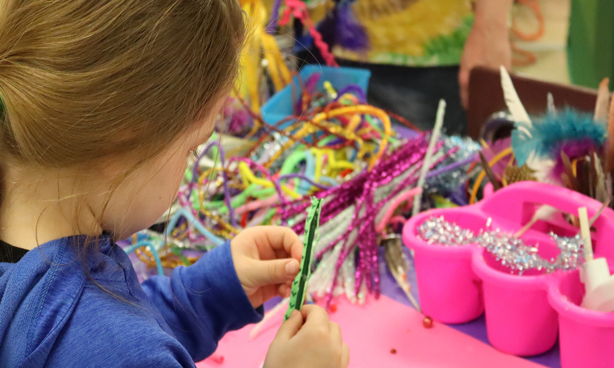 girl completing an art project