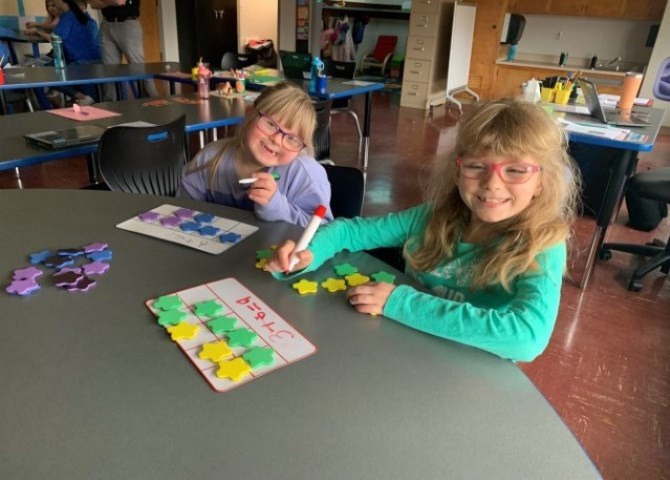 Two students smiling for a photo